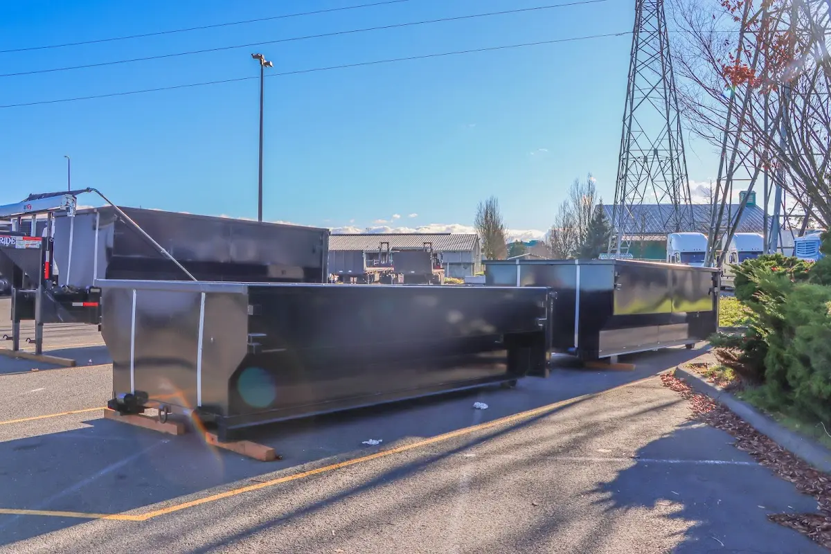 Roll-off dumpster ready for waste disposal at job site for 2 Yard Dumpster Rental in West Melbourne